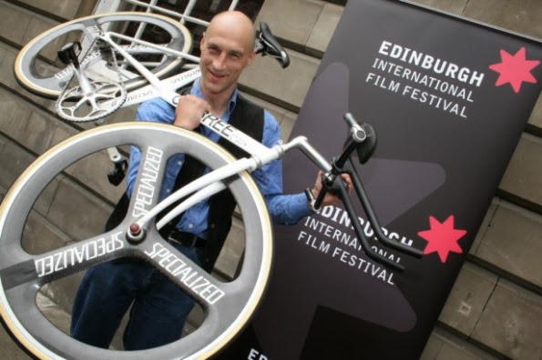Graeme Obree, with his hour record bike on his shoulder