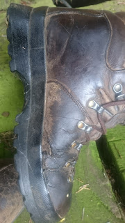 Left hand Scarpa boot, showing damage to the upper.