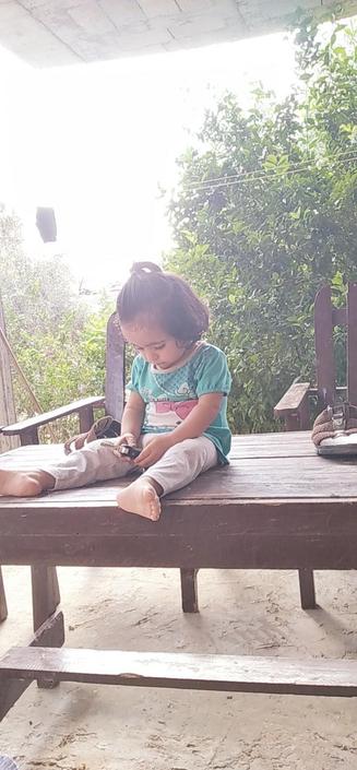 Kinda as a small child (about 3) sitting on the table in the garden.