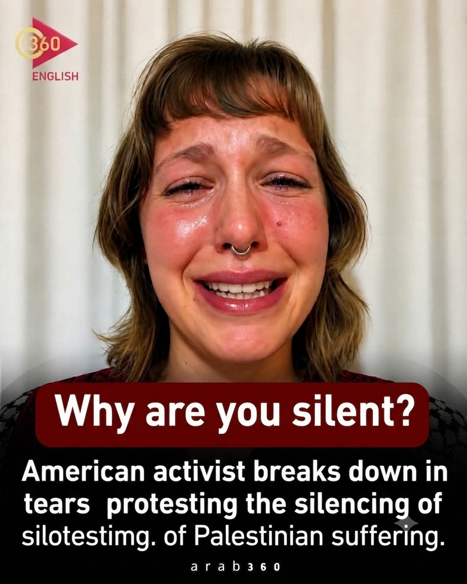 A young white woman, with a nose ring, in tears.